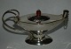 Oil lamp in 
silver with a 
piece of amber 
as the lid 
knob. Decorated 
in Art Nouveau 
style. Made ...