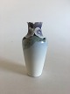 Rørstrand Art 
nouveau vase by 
Astrid Ewerlöf. 
Measures 
17,5cm, 
pierced, has 
chips on the 
top rim.