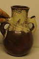 Kähler, luster 
glaze pottery 
vase, probably 
by Karl Hansen 
Reistrup. 23 ½ 
cm. high. In 
perfect ...