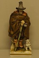 Capodimonte porcelain figurine in overglaze technic depicts a vagabond with a 
dog.