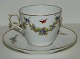 Frail cup in 
porcelain from 
Royal 
Copenhagen. 
Decorated with 
flowers and 
butterflies in 
...