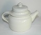 White glazed 
teapot in 
ceramics from 
Arabia, 
Finland. Is in 
perfect 
condition. 
Factory mark on 
...