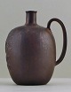 Arne Bang. Ceramic jug with "C.L.O.C CACAO" as text.