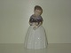 Royal 
Copenhagen 
Figurine, Girl 
in National 
Custome from 
"Amager". 
Decoration 
number ...