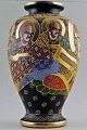 Large Japanese 
Satsuma 
earthenware 
vase. Decorated 
with men and 
woman in 
profile. In 
perfect ...