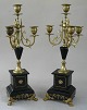 Pair of French 
candelabra with 
four light 
arms, brass and 
black marble; 
legs in bronze 
in the ...