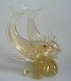 Venetian glass 
figure of two 
jumping 
dolphins. 
1960's, Italy. 
Clear glass 
with inner gold 
and ...