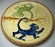 Danish plate in 
clay, 20th 
century with 
decorations in 
the form of 
hanging monkeys 
in a tree. ...