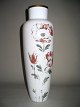 German opaline 
vase with 
paintings, 
white. Painted 
with tulips and 
gold edges. 
About 1900. 
Worn ...