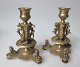 Pair of bronze 
candlesticks, 
19th century. 
France. With 
decorations on 
foot with 
sitting lions; 
...