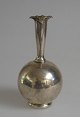 Orchid vase in 
silver, 20th 
century. Round 
body with 
conical neck 
with ruffles. 
Denmark, design 
...