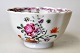 Small bowl, China, with wavy edge. Decorated with flowers in polycrome enamel colors. With ...