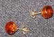 Ear sticks, in 
14 carat gold 
with amber. 
Flemming Rensch 
Nielsen, 
Ebeltoft, 
Denmark 
(1974-2002). 
...