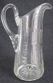 Danish milk jug 
in clear glass 
with grindings, 
o. 1900. With 
snail and tusk. 
H: 23 cm. 
Perfect ...