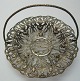 Small silver 
plated tray, 
filigree with 
flowers, 19th 
century. With 
handle and 
foot. H .: 10 
cm. ...