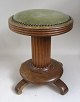 Piano stool in 
oak, Denmark, 
around 1900, 
with round base 
with four small 
legs, circular 
foot, ...