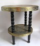 Chinese tea 
table 20 C. 
With 4 turning 
black painted 
legs with 2 
brass plates 
decorated with 
...