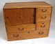 Japanese table 
cabinet, 19th 
century. Bright 
mahogany. With 
5 drawers and 
sliding doors 
under ...