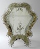 Venetian table 
mirror, 20th 
century. With 
rocailles and 
flowers. On 
glass - cut 
decorations. H 
...