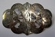 Brooch of 
silver about 
1900, Denmark. 
Decoration in 
shape&nbsp;of 
sea monsters. 
Previously belt 
...