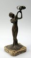 German Art Nouveau figure in patinated metal, ca.1900. In the form of a standing woman with a ...