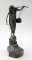 Art Nouveau 
figure in 
patinated 
bronze, approx. 
1900. In the 
form of a woman 
with a 
yoke that ...