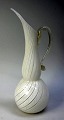 Glass pitcher, 
Murano o. 1960, 
Zanfirico, 
handle with 
gold dust. 
Clear glass 
with white 
glass ...