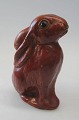 Money Box in 
clay, Bornhom, 
19th century. A 
sitting hare. 
Red glazed with 
black eyes. H: 
14 ...