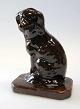 Money Box in 
clay, Bornhom, 
19th century. A 
sitting poodle. 
Brow glaze. H 
.: 15 cm.