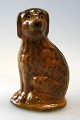 Money Box in 
clay, Bornhom, 
19th century. 
In the form of 
a seated dog. 
Yellow-brown 
glaze. With ...