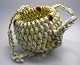 African bag, 20th century. Of small snail shells. East Africa. H .: 14 cm. Dia .: 16 ...