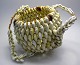 African bag, 
20th century. 
Of small snail 
shells. East 
Africa. H .: 14 
cm. Dia .: 16 
...