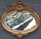 Gilded oval 
Nyrococo 
mirror. 
Denmark, 19th 
century. 
Faceted mirror. 
Decorated with 
rocailles, ...