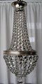 Large crystal 
chandelier, 
about 1900, 
with sack. 
Silver plated 
ring and crown. 
With a total of 
...