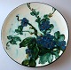 Pancake dish, 
pottery, c. 
1930 cowhorns 
decoration in 
green, blue, 
black, brown 
and bright. Dia 
...