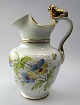 German 
chocolate 
lion-jug, 
porcelain, 
about 1900. 
Hand painted 
with pansies 
and gilding. 
Stamped ...