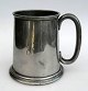 English pewter 
mug, 19th 
century. 
Sheffield. 
Stamped in the 
bottom., H .: 
12 cm.