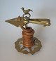 Wax pile holder 
("clampstick") 
of brass, 18th 
century. 
Openwork brass 
base plate with 
tripod. ...