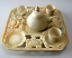 Chinese tea set in alabaster, c. 1900. Comprising dish with lotus flowers, 3 cups with chips to ...