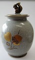 Craquelle vase, 
Royal 
Copenhagen, 
decorated with 
nuts and 
squirrels. 
Fluted body 
with a lid with 
...