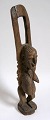 Figure in wood, 
Nigeria, c. 
1900. A woman 
with upraised 
arms. H .: 47.5 
cm.