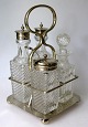 Plet&nbsp;de&nbsp;menage, 
about&nbsp;1900. 
England. Silver 
plated. 
Consisting of 
four containers 
...