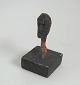 Malvin, Sven (1923 -) Sweden: Face. Carved wood. H: 10 cm. Designated under foot.Provenance: ...