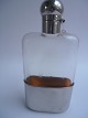 Flask in glass 
with stain mug, 
Denmark approx. 
1920.
19.5cm. high.