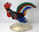 Venetian 
figurine of 
glass in the 
form of 
rooster, 20th 
century. Many 
Colored glass 
with gold ...