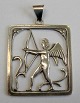 Pendant with 
cupid and 
arrow. Silver. 
Denmark. 
Stamped SM 830. 
Design: S.H. 
Mathiesen, 
Aalborg ...