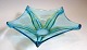 Large glass 
dish, 1960. 5 
divided star 
shape. Sea 
green glass 
mass and 
yellow. Dia .: 
37 cm.