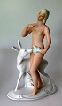 Schaubach 
figure of a 
naked woman 
with hind, 20th 
century. 
Germany. White 
porcelain mass 
with ...