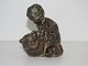 Royal 
Copenhagen 
stoneware 
figurine, boy 
with bear.
Designed by 
artist Knud 
Kyhn.
The ...