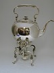 Hot water 
kettle and 
burner. Silver 
(830). Made by 
Samuel Prahl 
(1800-1885). 
Produced 1860. 
...